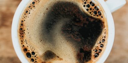 White ceramic mug of coffee representing caffeine and Armodafinil interaction