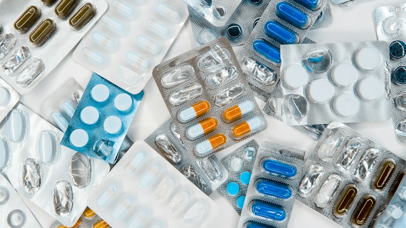 Pile of medication tablets representing Armodafinil dosage guidance
