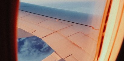 View through an airplane window representing jet lag and travel