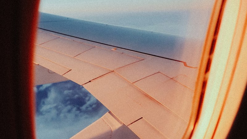 View through an airplane window representing jet lag and travel