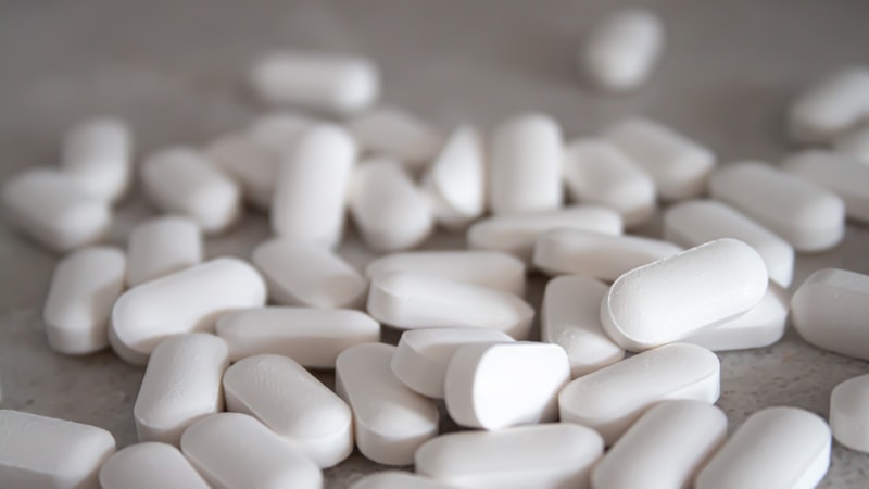 White Armodafinil tablets representing medication side effects management