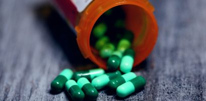 Prescription bottle with capsules representing long-term Armodafinil tolerance
