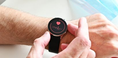 Person checking heart rate monitor on a smartwatch representing Ivabradine for heart rate control